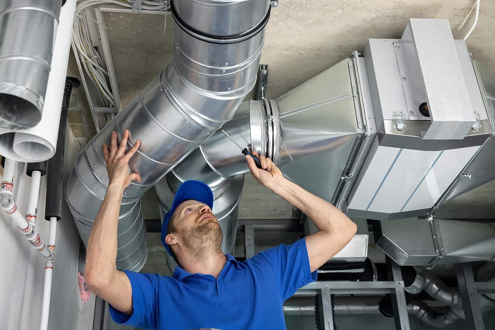 HVAC technician inspecting and repairing air ducts in Burbank