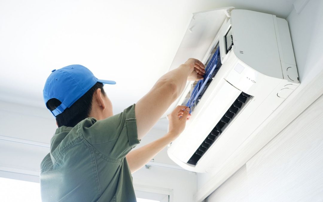 HVAC technician servicing a ductless mini split in Burbank