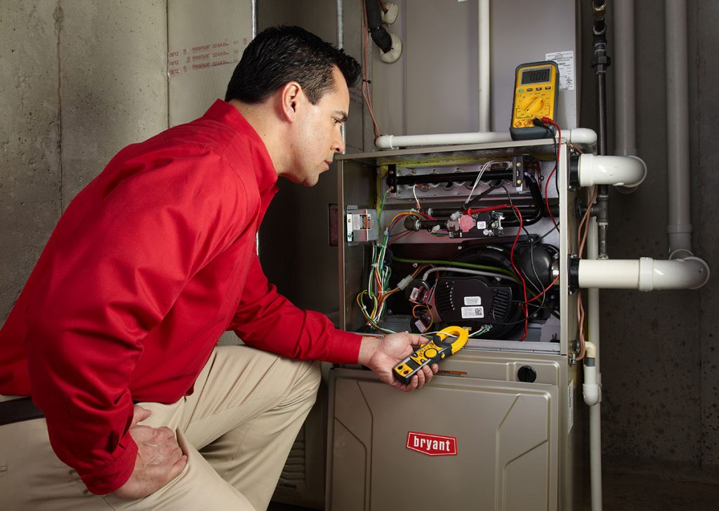 Heating technician diagnosing a furnace repair in Burbank