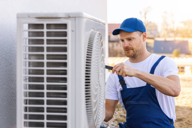 HVAC technician servicing an outdoor air conditioner in Burbank