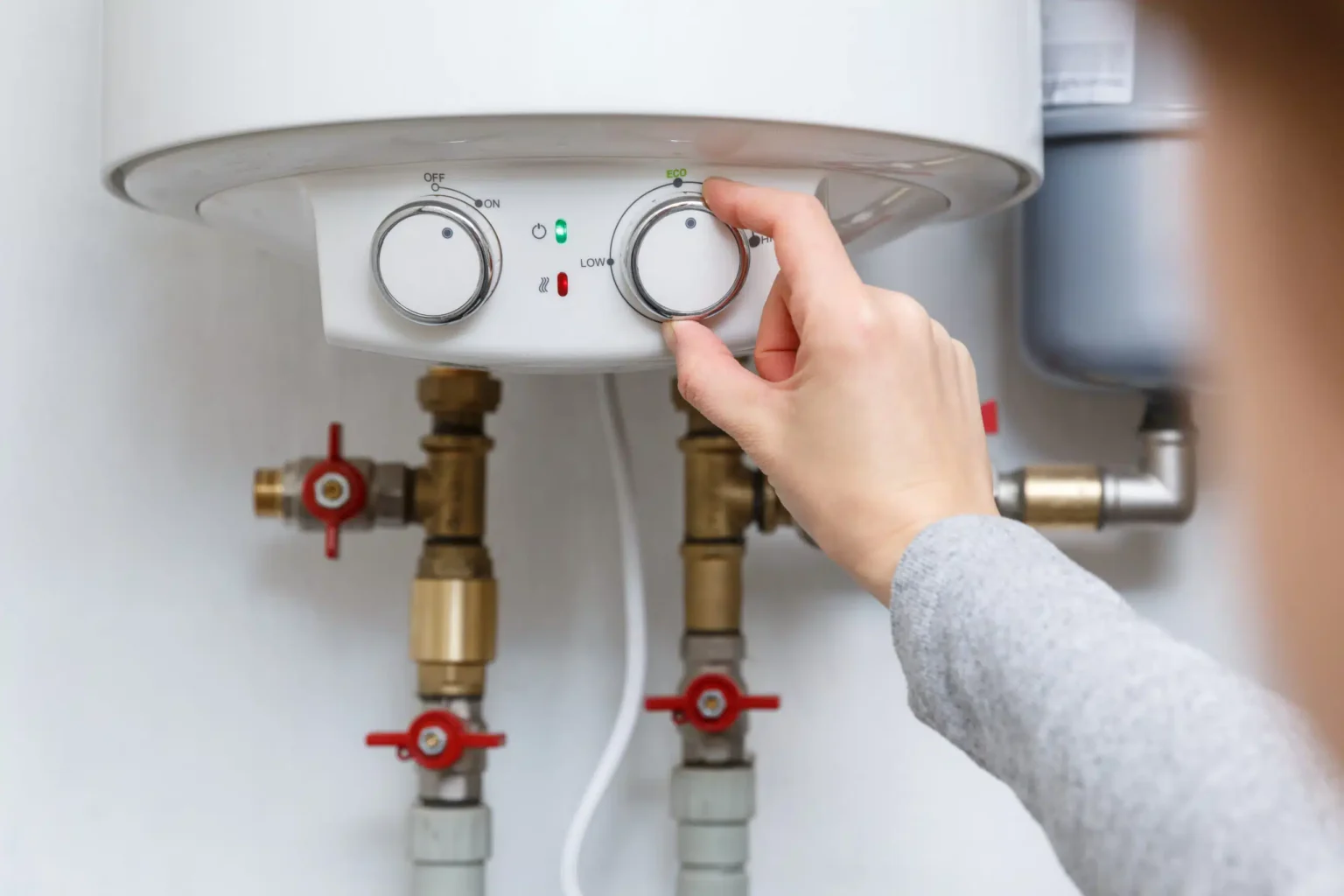 Technician adjusting a water heater in Burbank